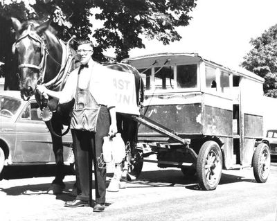 George Mumby guides horse and delivery wagon on horse's last day