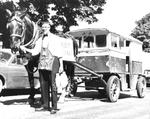 George Mumby guides horse and delivery wagon on horse's last day