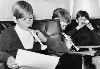 Students practice playing their recorders