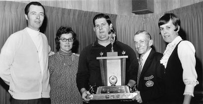 Foursome receive the Cornelius trophy for mixed curling