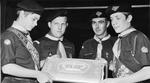 Cake bearing Queen's Scout badge served at ceremony