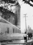 Georgetown fire department sprays the burning former Town Hall at Cross and Back Streets