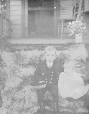 Two children on porch steps