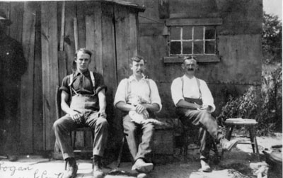 Three men on a bench at the Logan Quarry 1908