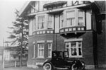 Gentleman starting motor car at Barraclough  House 1920