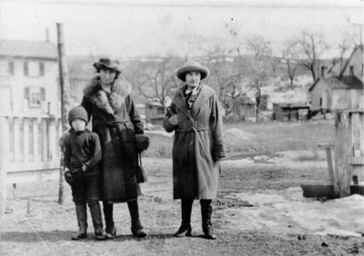 Two ladies and a boy c1920