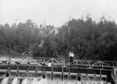 Man and child on footbridge c1930