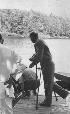 Man with broken foot on a dock.