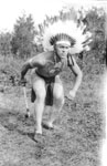 Man in Native headdress and loincloth