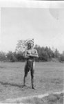 Man in Native headdress and loincloth, Three