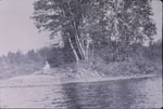 Woman sitting on a point of an island