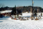 Snowmobiles parked at Crane Lake House