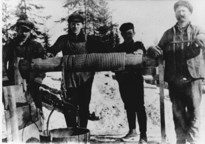 Four Miners at a well