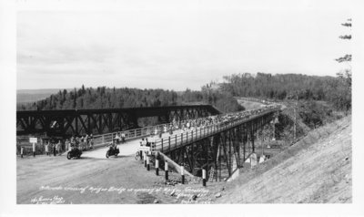 Motorcade crossing Nipigon Bridge at opening of Nipigon.