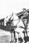 Unidentified man in uniform on horse