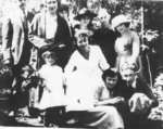 Unidentified group of people having a picnic at the shack