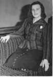 Unidentified woman kneeling on couch