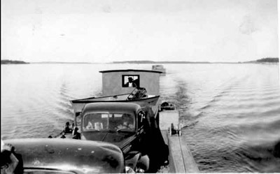 Gravel Trucks Arrive At Pakwash Bay By Scow