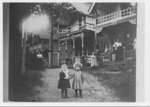 Two children in front of cottages on Auditorium Circle