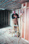 Ralph Walsh installing new wiring at Township office