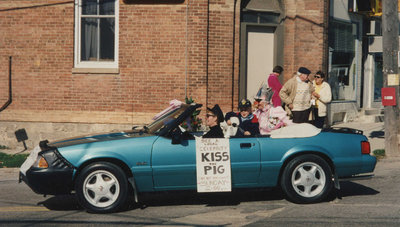 Advertising Kiss the Pig contest in Split Rail Parade