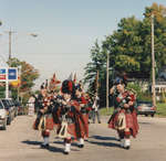 Scottish Pipers march and play in the Split Rail Parade