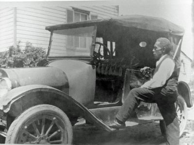 John Henry Shepherd Standing with Car