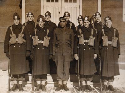 Henry Shepherd with soldiers at Newmarket Training Centre