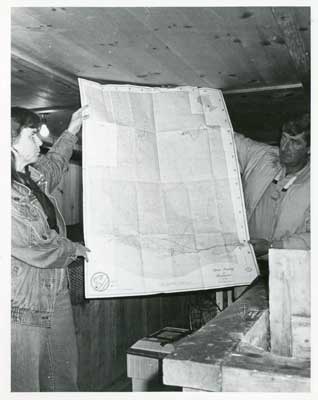 Two people with Sports Fishing and Recreation Map, Thessalon Township, Circa 1995