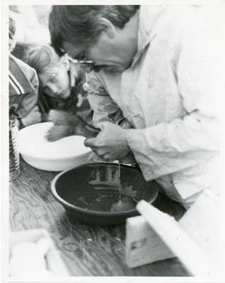 Close-up of Man harvesting fish eggs, Thessalon Township, Circa 1995