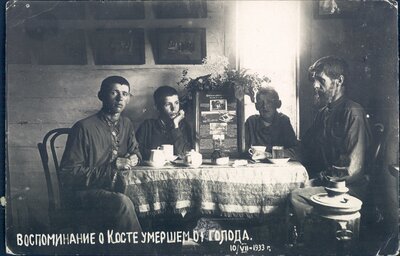 Nikolai Bokan and three of his sons commemorate the death of Konstantin Bokan, who died of starvation.