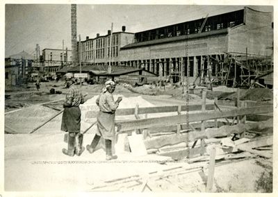 Two women workers at an industrial site near the Dnipro Hydroelectric dam