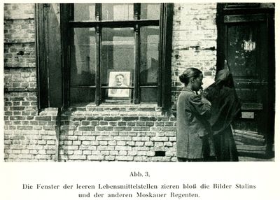 Two women about to enter an unidentified establishment in Kharkiv