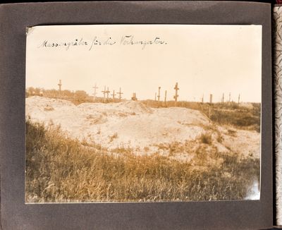 Freshly dug mass graves near an older existing cemetery near Kharkiv