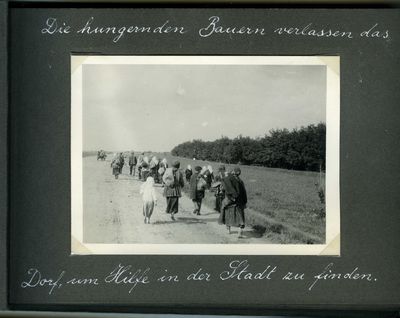 Several families from the countryside on their way to Kharkiv by foot