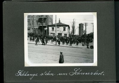 Large crowd of people waiting outside a Khatorh for black bread