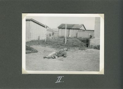 A starving farmer tries to lean on an elbow as he lies near a house in Kharkiv (Death by starvation series, no. 2)