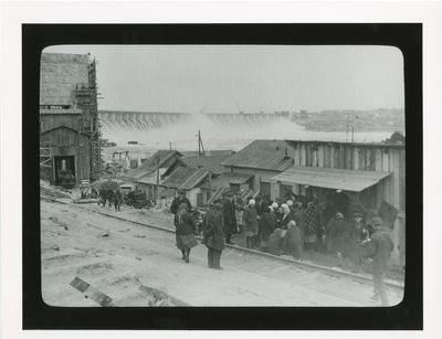 Crowd of people waiting for a food distribution center to open at the Dnipro Hydroelectric Dam construction site