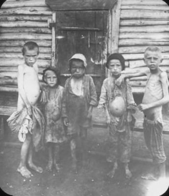 Non-Holodomor: Five young boys in Russia show evidence of swelling and starvation, with one boy pointing out the bloated stomach of the boy next to him