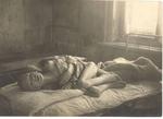 Non-Holodomor: An emaciated child lies wracked with pain in a medical facility set up by  international relief agencies working in Samara, Russia