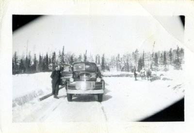 Unidentified Man Standing With Logging Truck, Circa 1940