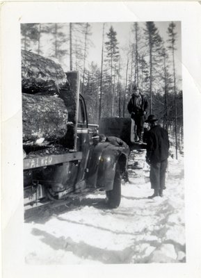 Three Men and Logging Trucks, Circa 1950