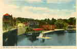 View of the Muskoka River in Huntsville, Ontario: the swing bridge, waterfront, town dock, Main Street,
J.R. Boyd and Son store, steamboat Algonquin at far right.