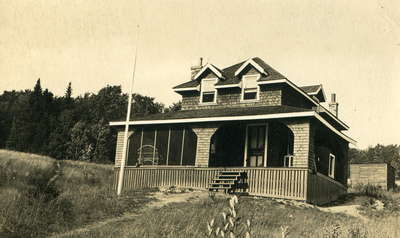 Awatto Cottage, later known as Monkhouse Cottage at Fairyport, Fairy Lake, Huntsville, Ontario, in the 1920's.