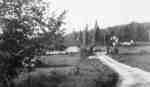Road into Fairyport, Fairy Lake, Huntsville, Ontario, showing the entrance gateway and the farmhouse on right. 1934.
