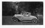 Harry MacKay at Fairyport, Fairy Lake, Huntsville, Ontario, 1937, in a 1930 Desoto convertible automobile.