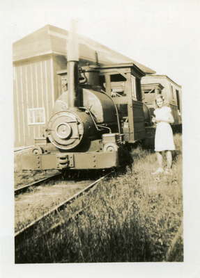 Portage Flyer, Joy MacKay standing in front. North Portage, Penninsula Lake, Lake of Bays, Ontario, 1939.