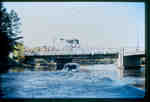 Swing bridge over the Muskoka River, Huntsville, Ontario, with motor launch, 1980-1990.