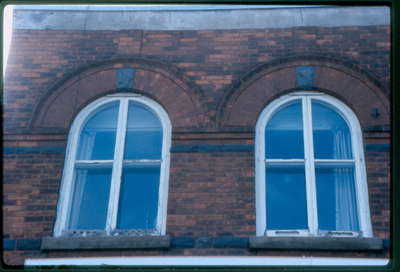 The Bookcase, 93 Main Street East, Huntsville, Ontario, 1980-1990, upper windows.