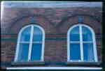 The Bookcase, 93 Main Street East, Huntsville, Ontario, 1980-1990, upper windows.